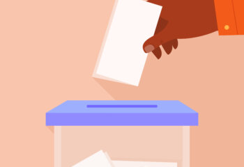 male hand putting voting paper in ballot box