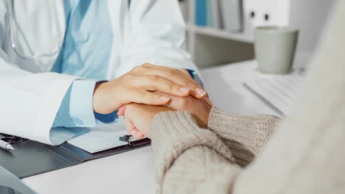 Close up of Young Asian woman doctors talking with the patient about mental health, for recover wellbeing and be a healthy lifestyle in health clinic. Medical health care concept.